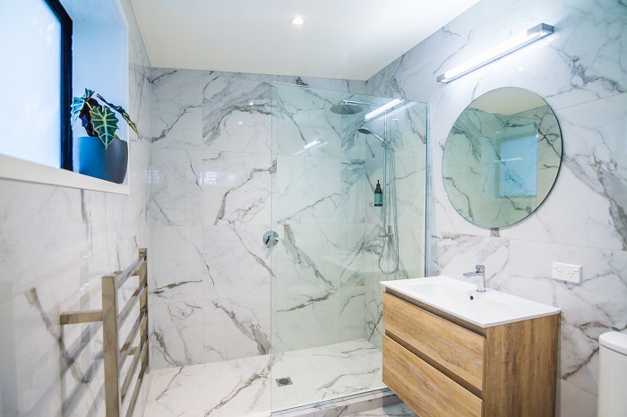 New Wave Construction Titirangi Bathroom with White Marble Wall Tiles